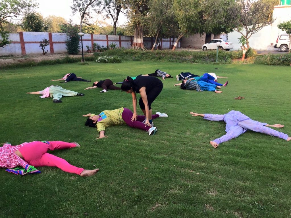 A person practicing yoga poses as part of a weight loss routine.