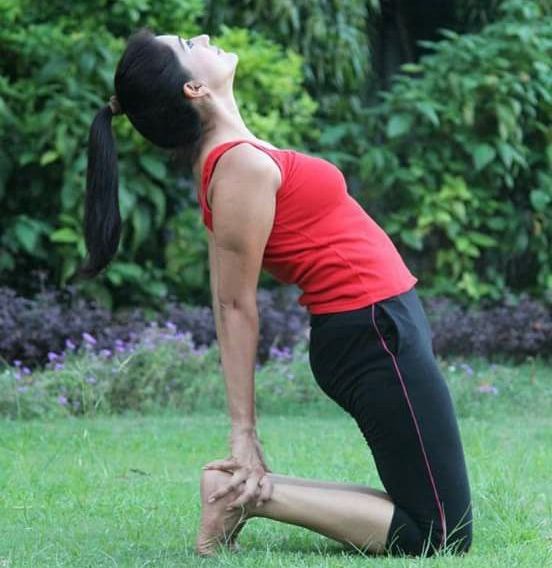 An individual practicing yoga poses during a training session.